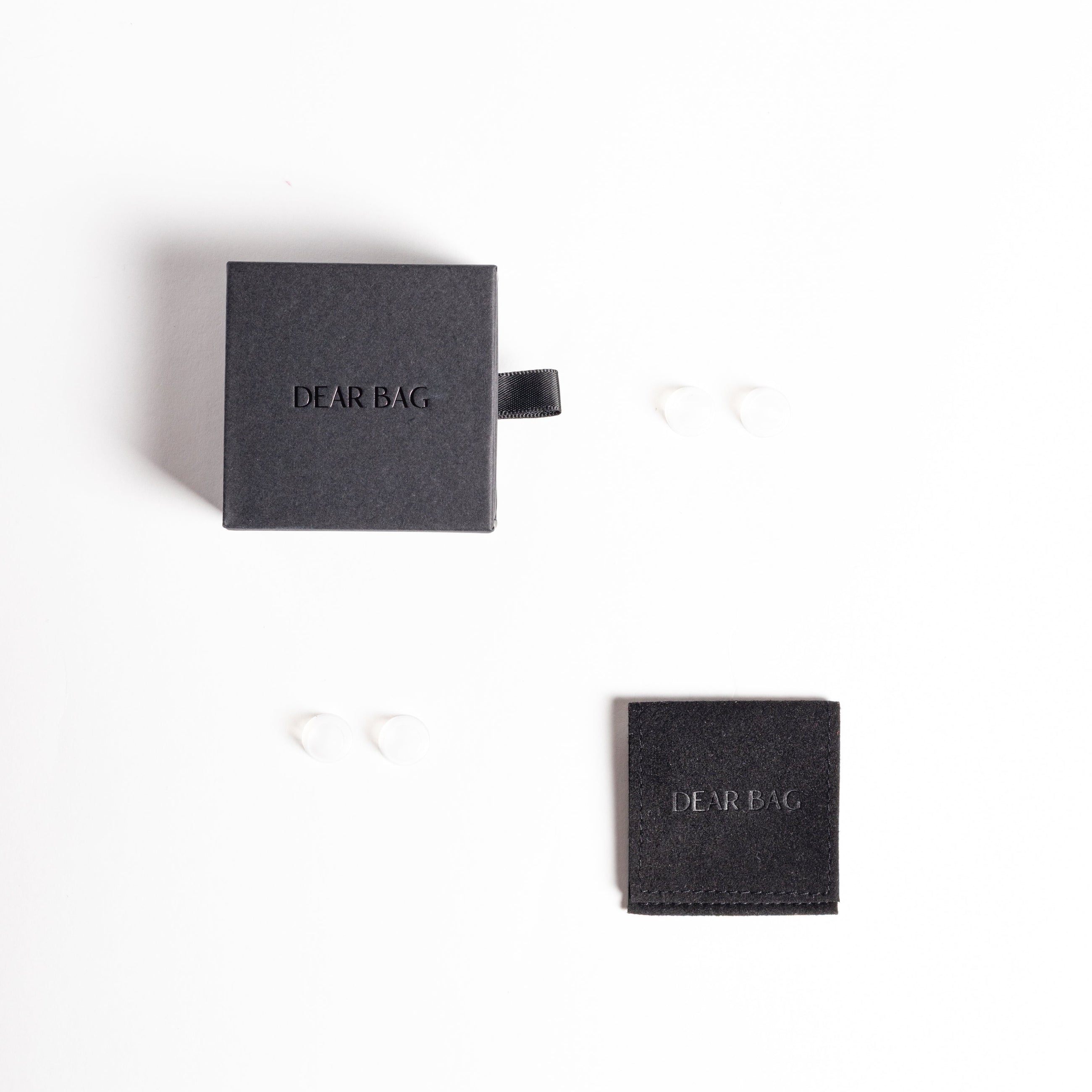 Two black boxes with 'DCBRAG' branding on a white background